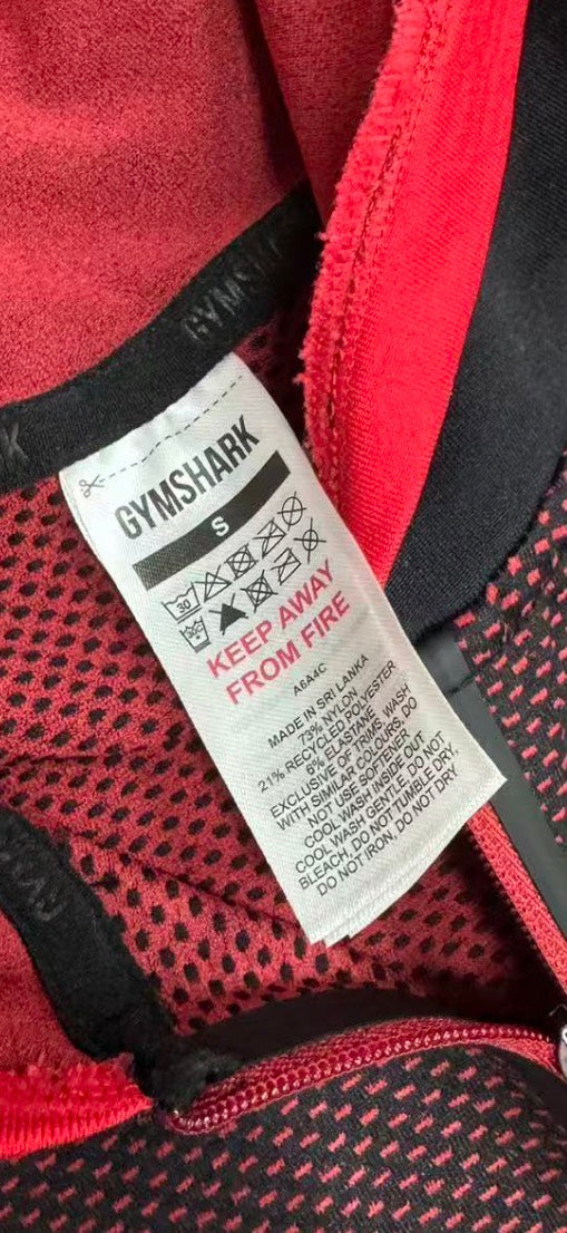Supplier documentation showing the Carmine Red garment label